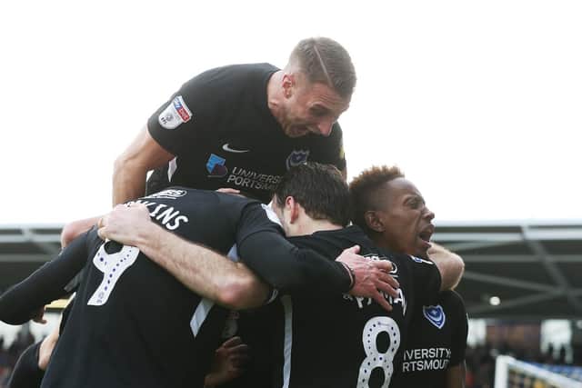 Pompey celebrate Brett Pitman's goal at Shrewsbury last season. Picture: Joe Pepler