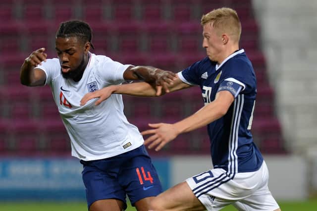 Ross McCrorie battles Joshua Onomah for the ball for Scotland under-21s against England. Picture: Mark Runnacles/Getty Images