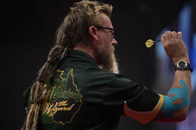 Simon Whitlock with his elbow strapped up at Winter Gardens, Blackpool. Picture: Lawrence Lustig/PDC
