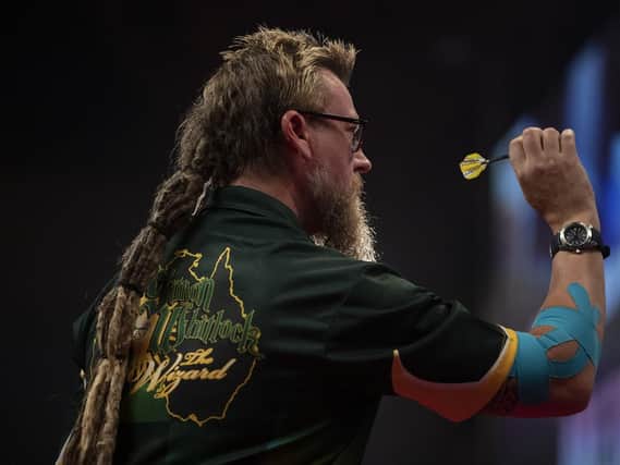Simon Whitlock with his elbow strapped up at Winter Gardens, Blackpool. Picture: Lawrence Lustig/PDC