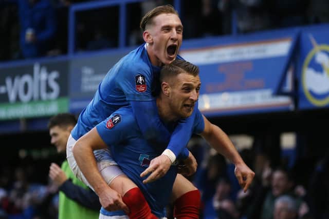 Lee Brown and Ronan Curtis celebrate Joel Lynch's scores own goal during Pompey's 1-1 FA Cup draw with QPR. Picture: Joe Pepler