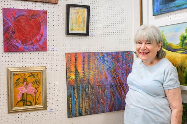 Pictured is: Victoria Levy with some her work at the exhibition.

Picture: Keith Woodland (270719-13)