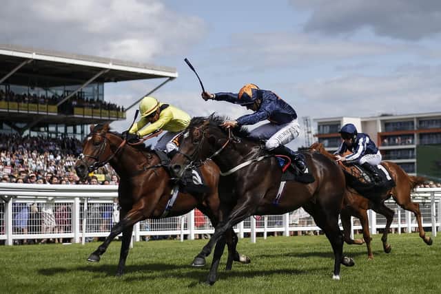 Hey Gaman, right, wins The Denford Stakes at Newbury earlier in his career. Picture: Alan Crowhurst/Getty Images
