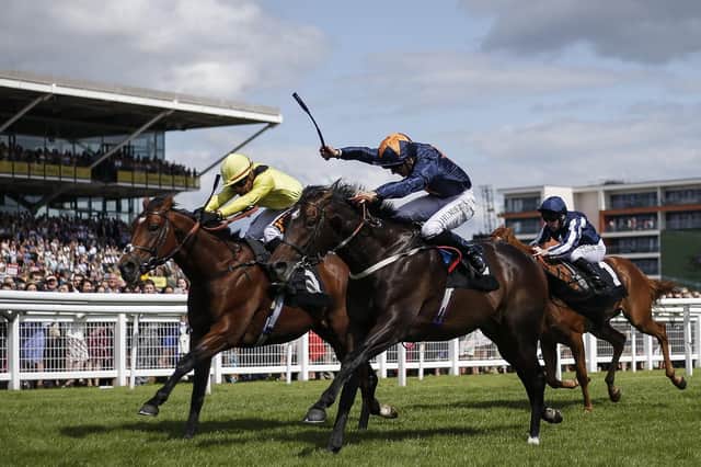 Hey Gaman, right, wins The Denford Stakes at Newbury earlier in his career. Picture: Alan Crowhurst/Getty Images