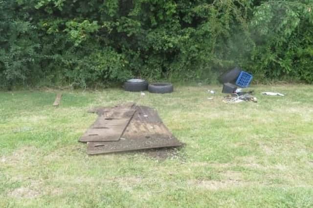 Rubbish, including charred wood and tyres, left by travellers at Hampshire Farm Meadow, Emsworth, on Sunday, July 28.