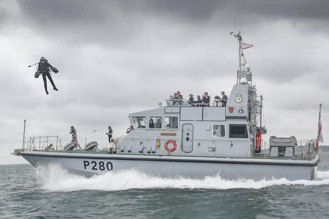 Flying high: chief test pilot Richard Browning hovers above HMS Dasher. Photo: LPhot Daniel Shepherd