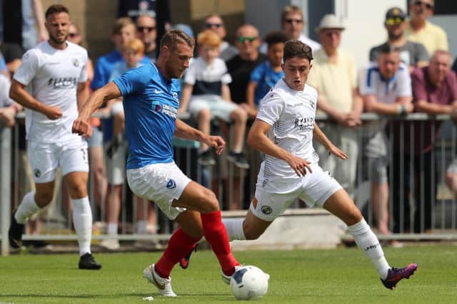 Benny Read puts Pompey's Lee Brown under pressure during the pre-season friendly at Westleigh Park this summer. Picture: Dave Haines