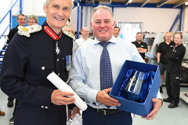 CTS Europe managing director Sean Codling given his award by Lord Lieutenant of Hampshire, Nigel Atkinson. Picture: Malcolm Wells (190725-4933)