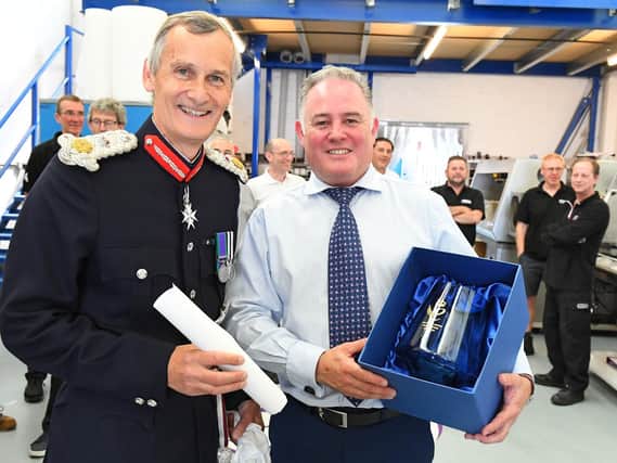 CTS Europe managing director Sean Codling given his award by Lord Lieutenant of Hampshire, Nigel Atkinson. Picture: Malcolm Wells (190725-4933)