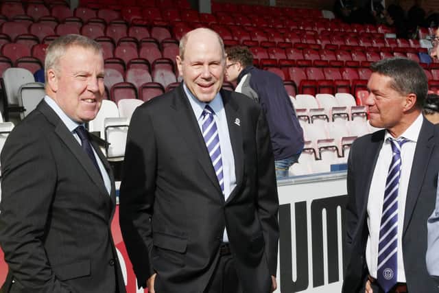 Pompey owner Michael Eisner, centre, with manager Kenny Jackett, left, and chief executive Mark Catlin. Picture: Joe Pepler
