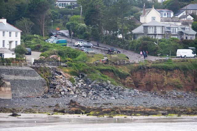 Rocks and debris which have fallen away from the sea wall in Coverack, Cornwall, after intense rain caused flash flooding in the coastal village.