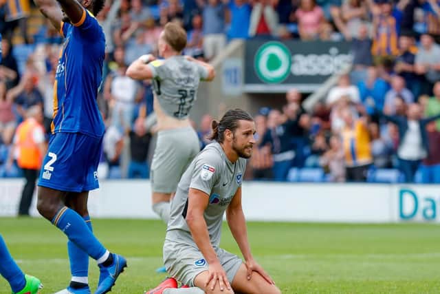 Christian Burgess feels the frustration of defeat at Shrewsbury. Picture: Simon Davies