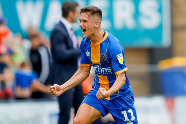 Shrewsbury Town midfielder Ryan Giles celebrates his winner against Pompey Picture: Simon Davies