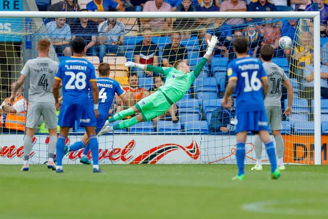 Craig MacGillivray attempts to stop Ryan Giles' winner for Shrewsbury Picture: Simon Davies