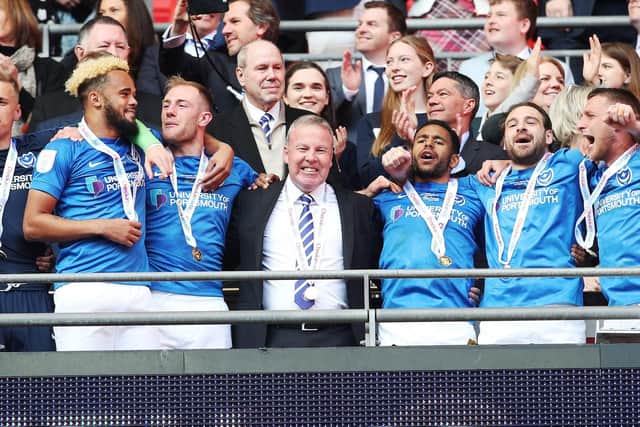 Kenny Jackett, centre, celebrates Pompey's EFL Trophy triumph at Wembley with his Pompey players. Picture: Joe Pepler
