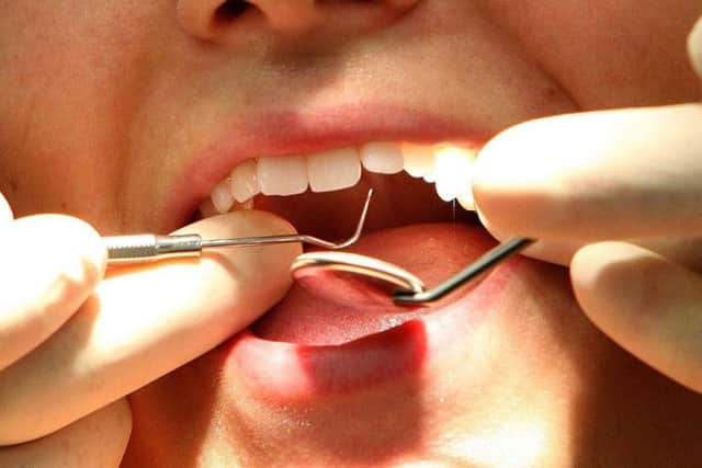 A dentist at work. Picture: PA.