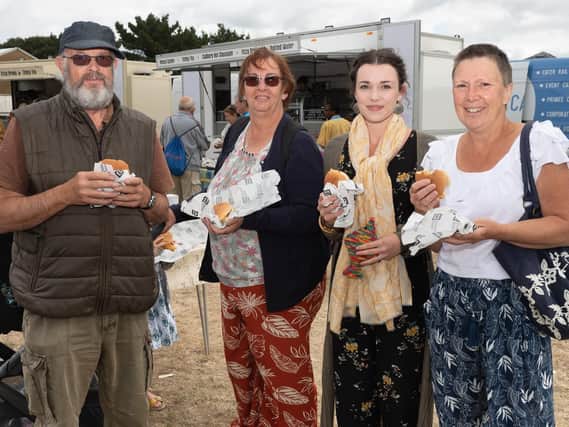 Pictured is: Phillip West, Helen Marshall, Kezia Richardson, Janice West enjoy there fish in a bun.

Picture: Keith Woodland (070919-21)
