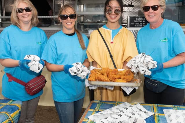 Pictured is: Helen Bolton, Elaine Hallet, Ee Wan and Wendy Evans serving the fish in buns.

Picture: Keith Woodland (070919-6)