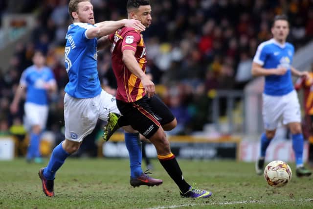 James Meredith (right) in action against Peterborough during his Bradford City days. Picture: Joe Dent/JMP
