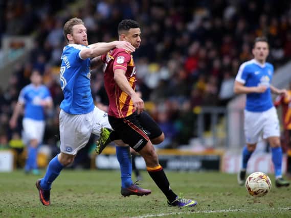 James Meredith (right) in action against Peterborough during his Bradford City days. Picture: Joe Dent/JMP