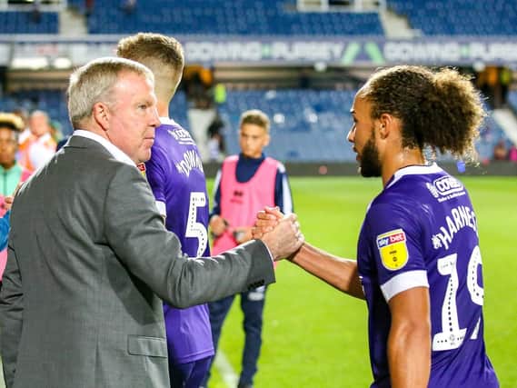 Kenny Jackett congratulates  Marcus Harness after Pompey's win at QPR. Picture: Nigel Keene