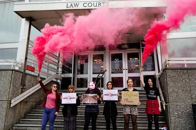 Dylan Roffey, 24, (right) alongside supporters outside Brighton Magistrates Court. Picture: DxeBrighton/PA Wire
