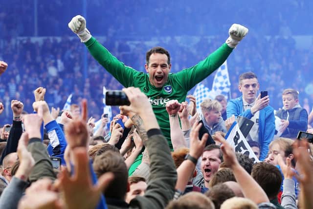 David Forde celebrates Pompey's League Two title triumph. Picture: Joe Pepler