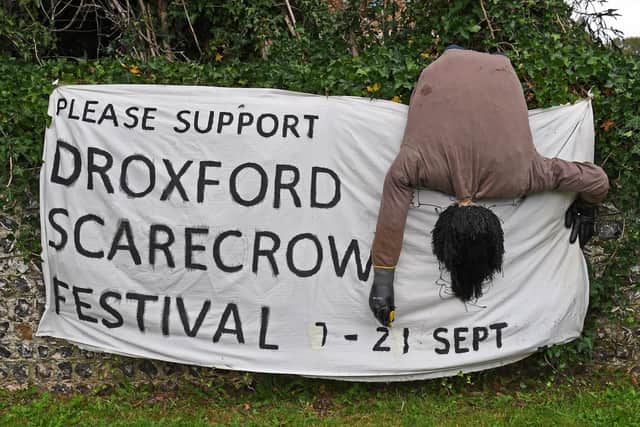 A Scarecrow Festival banner in The Square at Droxford on the A32. Picture: Malcolm Wells (190911-7584)