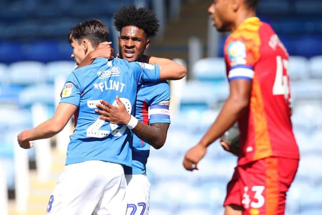 Portsmouth's Ellis Harrison celebrates with Josh Flint