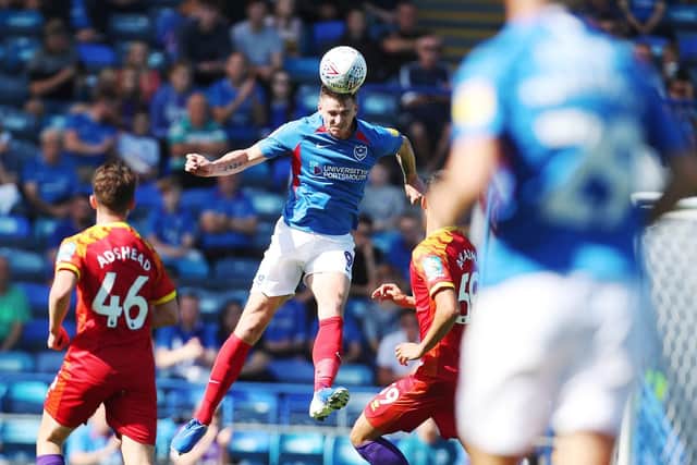 Portsmouth's Oliver Hawkins rises for a header