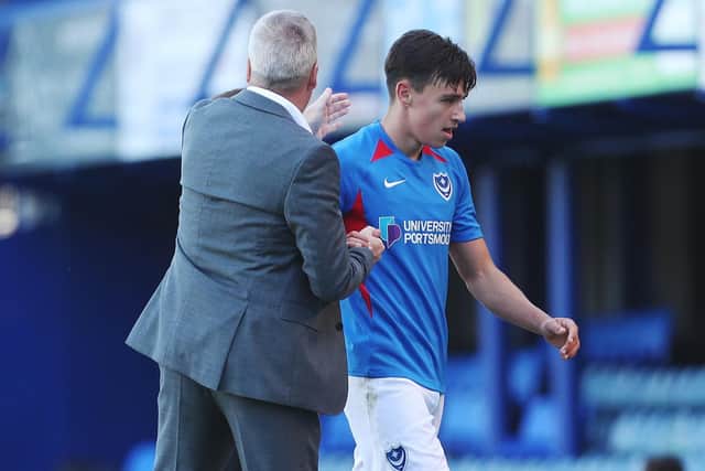 Kenny Jackett congratulates Josh Flint after coming off on his debut. Picture: Joe Pepler