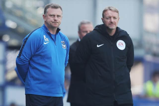 Coventry manager Mark Robins, left Picture: Joe Pepler