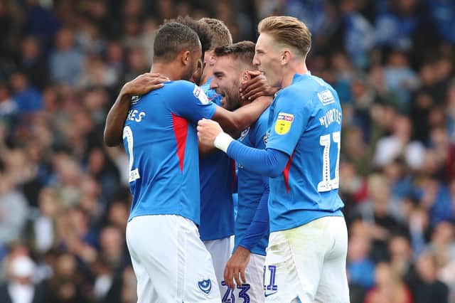 Ben Close is congratulated by his Pompey team-mates Picture: Joe Pepler