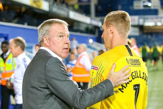 Pompey boss Kenny Jackett, left, with goalkeeper Craig MacGillivray