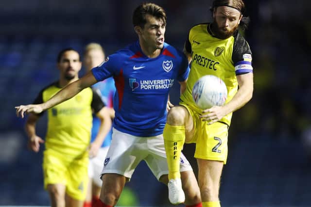 John Marquis battles for the ball