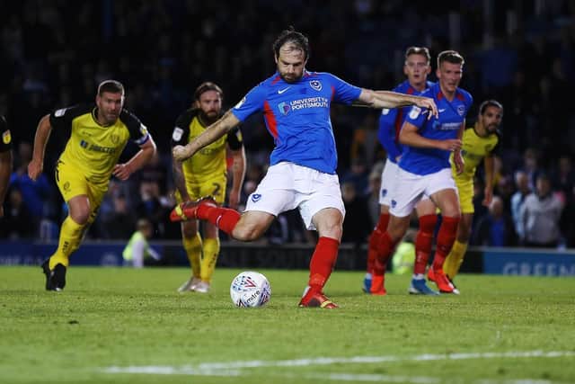 Brett Pitman successfully scored his 10th Pompey penalty to secure a 2-2 draw with Burton. Picture: Joe Pepler
