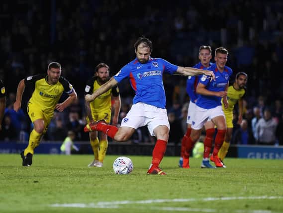Brett Pitman successfully scored his 10th Pompey penalty to secure a 2-2 draw with Burton. Picture: Joe Pepler