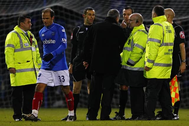 Avram Grant confronts referee Kevin Friend during Pompey's Premier League game against Sunderland in February 2010