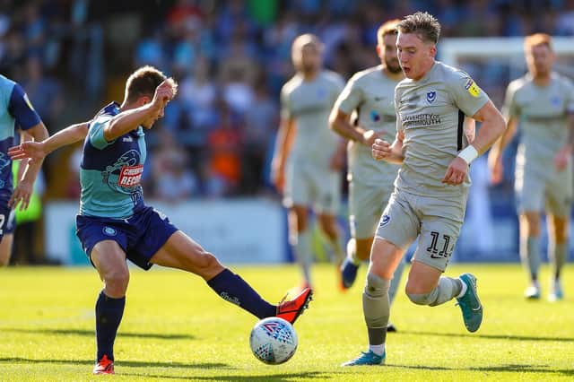 Pompey forward Ronan Curtis is challenged by Wycombe Wanderers midfielder Dominic Gape