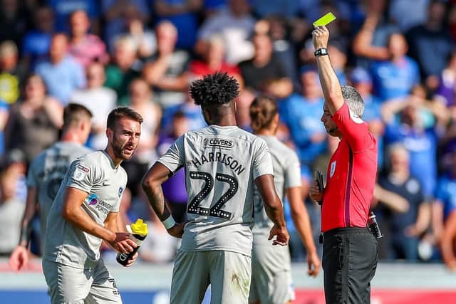 Ellis Harrison receives his second yellow card, and subsequently a red, during Saturday's 1-0 defeat at Wycombe. Picture: Nigel Keene/ProSportsImages