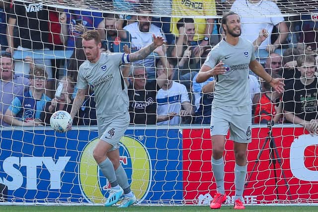 Tom Naylor, left, and Christian Burgess express their frustration after Adebayo Akinfenwa scores from the penalty spot. Picture: Nigel Keane