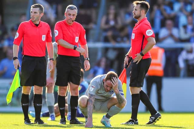 Tom Naylor cut a distraught figure at the final whistle of Pompey's 1-0 defeat at Wycombe on Saturday. Picture: Nigel Keene/ProSportsImages