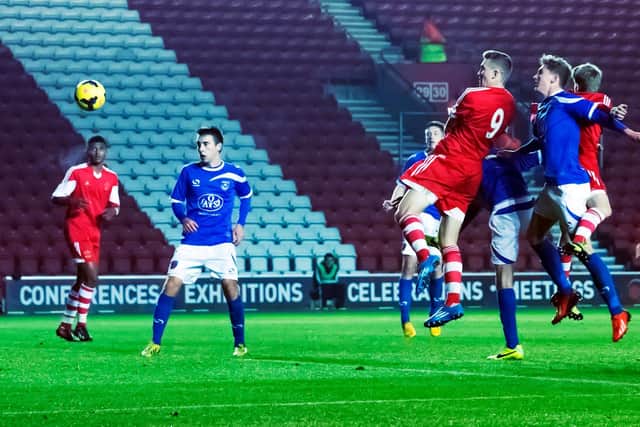 Sam Gallagher heads home, watched by Ben Close, in Southampton's 7-0 humbling of Pompey in the FA Youth Cup in December 2013. Picture: Barry Zee.