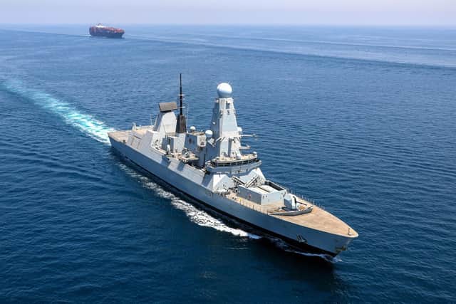Type 45 Destroyer HMS Duncan escorts the container ship Brighton throughthe international shipping lanes in the Gulf. Picture: Rory Arnold / Royal Navy