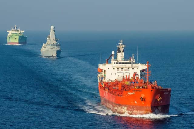 HMS Duncan safely escorts MV Mid Eagle and MV BW Magellen through the Straits of Hormuz. Picture: Jay Allen / Royal Navy