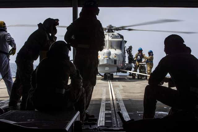 Pictured: 215 Flight conduct vertical replenishments with HMS Defender whilst in the Gulf of Oman. Picture: LPhot Dan Rosenbaum, HMS Kent