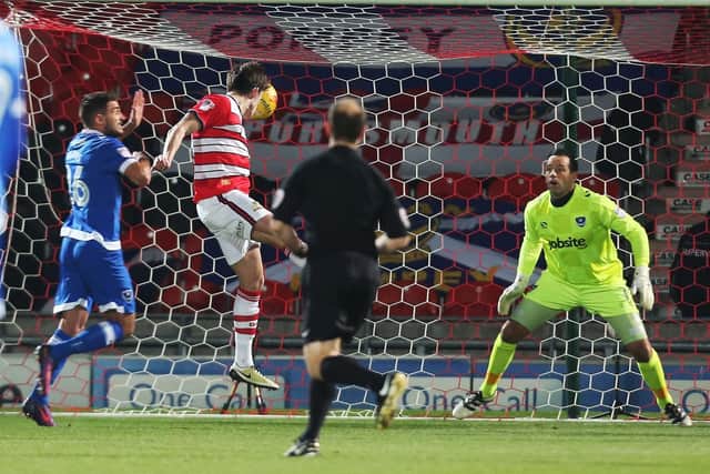 John Marquis heads home for Doncaster during the 2016-17 season. Picture: Joe Pepler