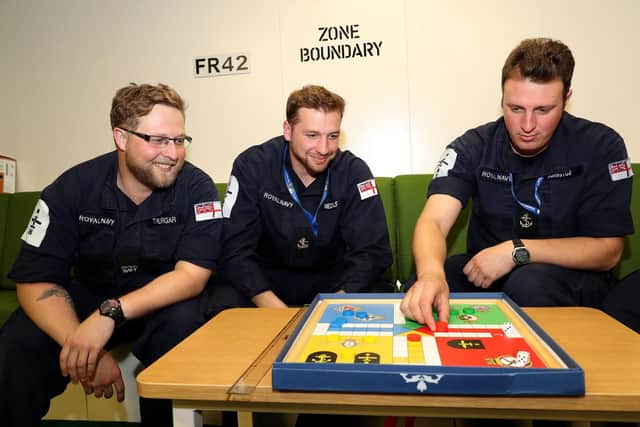 LA(AH) Medcalf, LA(AH) Johnston and NA(AH) Thurgar playing uckers on board HMS Queen Elizabeth. Picture: PO Phot Ray Jones