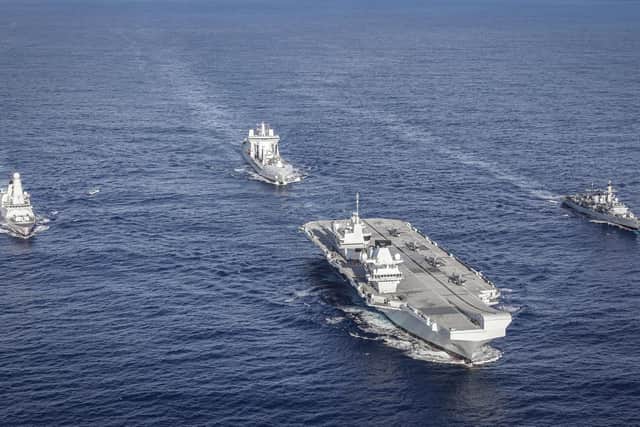 HMS Queen Elizabeth has arrived in Florida for the second time. Here she is pictured with HMS Northumberland, HMS Dragon and RFA Tideforce which are part of her carrier strike group. Photo: LPhot Kyle Heller