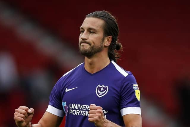 Man-of-the-match Christian Burgess celebrates Pompey's 2-1 win over Doncaster. Picture: Daniel Chesterton/PinPep